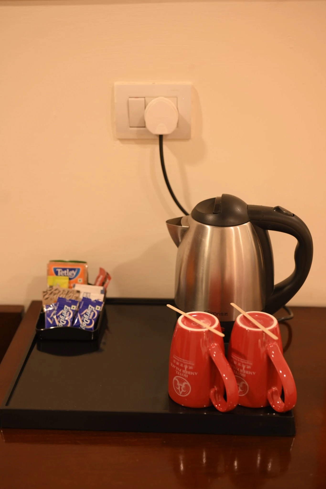Tea and coffee amenities in deluxe room at Amber Palace Hotel Gurgaon